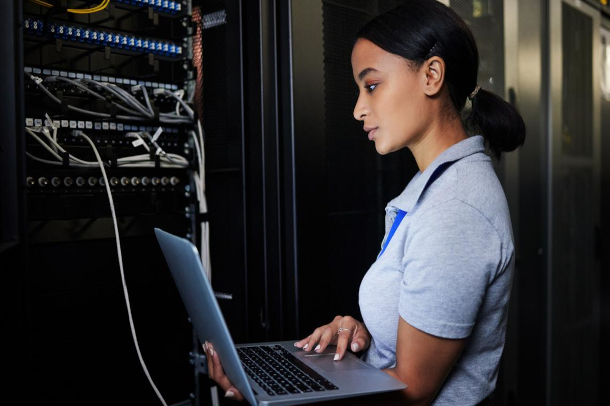 Woman working in server room