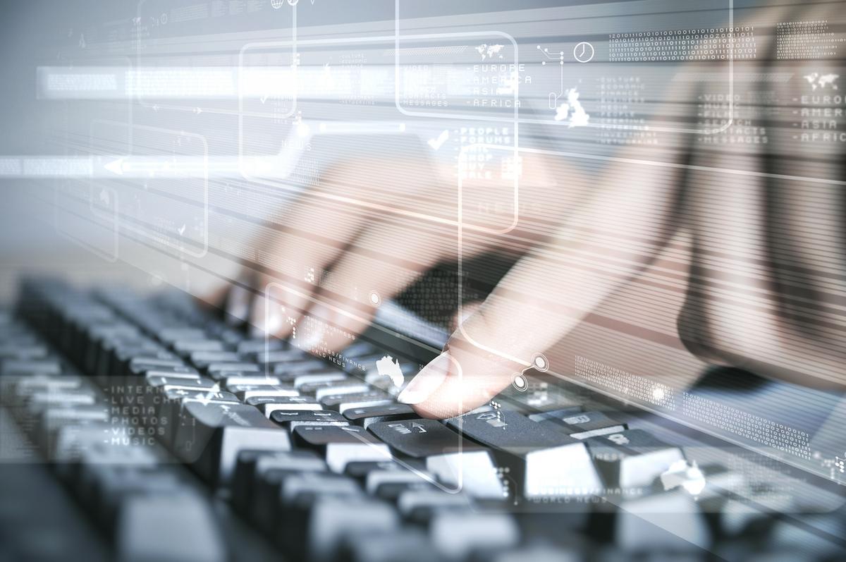 Man typing on keyboard